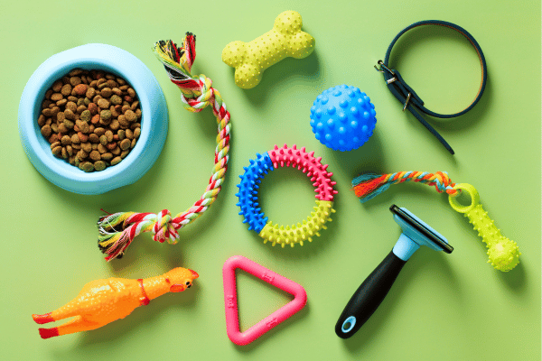 Assorted pet toys displayed against a vibrant green background